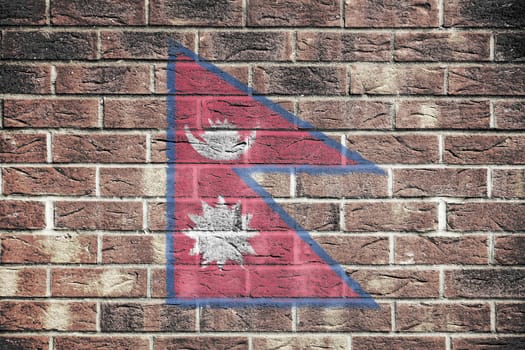 A Nepal flag on old brick wall background