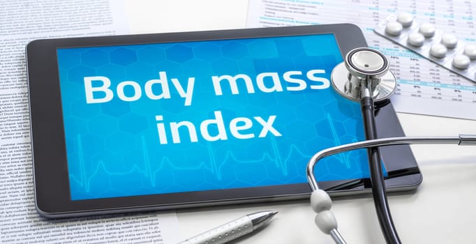A tablet with the word Body mass indexon the display