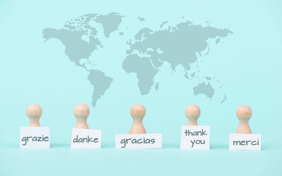Thank you day, word thanks in different languages, world map, being thankful, support, help and charity concept, positive attitude