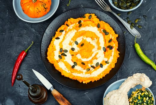 Autumn pumpkin risotto with parmesan cheese. Italian food. Top view