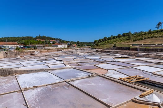 Rio Maior, Portugal: July 7, 2024: Fonte da Bica Salt Flats, aka Salinas de Rio Maior, system of shallow water compartments and gutters for salt extraction, Portugal