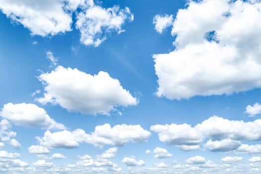 Beautiful blue sky and white cumulus clouds abstract background. Cloudscape background. Blue sky and fluffy white clouds on sunny days. Blue sky and daylight. World Ozone Day. Ozone layer. Summer sky.