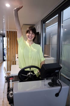 Model Cora is visibly having fun at the trade fair novelty,the brand new houseboat   The Interboot 2024 Friedrichshafen trade fair will open its doors on 25.09.2024