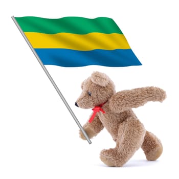 A Gabon flag being carried by a cute teddy bear