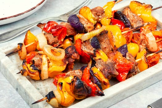 Grilled kebabs with vegetables on skewers.