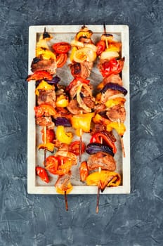 Grilled kebabs with vegetables on skewers. BBQ skewers. Top view.