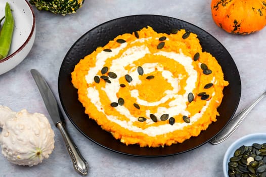 Risotto with pumpkin and parmesan cheese. Vegetarian vegan food. Close up.