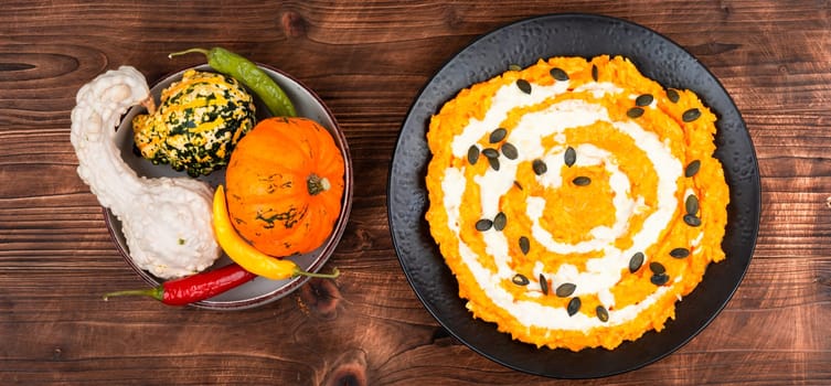 Risotto with pumpkin and parmesan cheese. Vegetarian vegan food. Close up.