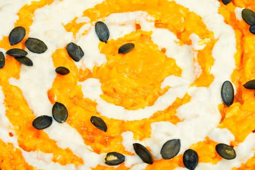 Risotto with pumpkin and parmesan cheese. Vegetarian vegan food. Close up.