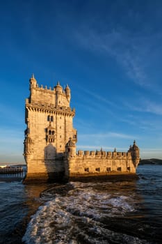 Belem Tower or Tower of St Vincent - famous tourist landmark of Lisboa and tourism attraction - on the bank of the Tagus River Tejo on sunset. Lisbon, Portugal