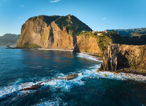 Aerial view of Madeira cliffs coastline landscape on sunrise, Guindaste viewpoint, Madeira island, Portugal