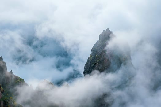 A mountain covered in fog and clouds. Near Pico de Arieiro , Madeira island, Portugal