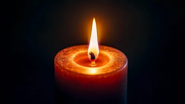 Single candle burns brightly in the darkness, casting a warm glow and flickering in red, orange, and yellow hues, evoking feelings of hope and tranquility for meditation