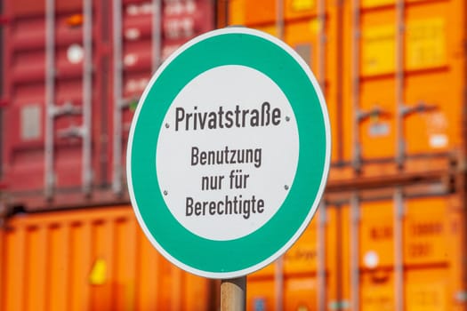 Private road sign, use only for authorized persons, freight container in port, Germany