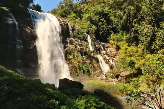 View onto the Wachirathan Waterfall, Wachirathan Falls with a small rainbow in the foreground, Mae Hong Son Loop, Doi Inthanon National Park, Thailand 2023