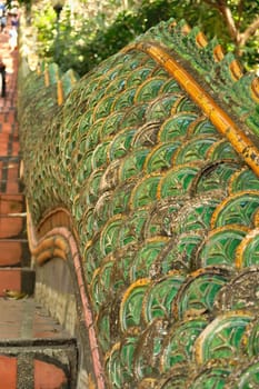 The Naga Stairway up to the Wat Phra That Doi Suthep Temple, stairs lined with two giant Phaya Nagas, Thai Dragons, Snakes, Serpent, close to Chiang Mai, Thailand 2023