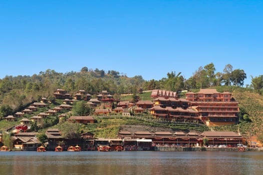 Picturesque view from the lake onto the Ban Rak Thai, Mae Aw Village, a chinese village in northern Thailand, close to the border to Myanmar, Mae Hong Son Loop, Thailand 2023