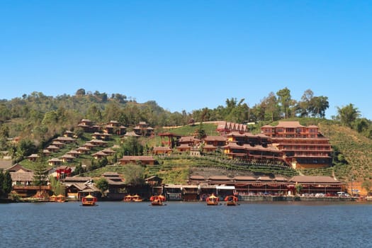 View from the lake onto the Ban Rak Thai, Mae Aw Village, a chinese village in northern Thailand, close to the border to Myanmar, Mae Hong Son Loop, Thailand 2023