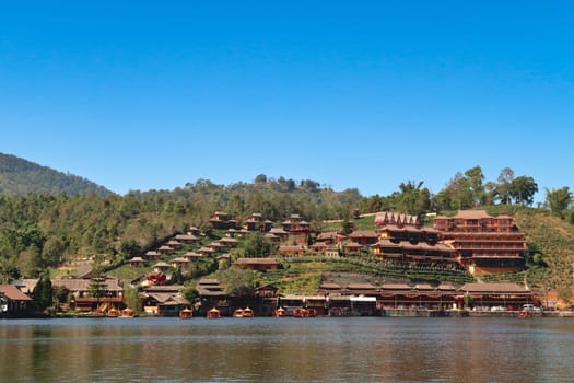Beautiful view from the lake onto the Ban Rak Thai, Mae Aw Village, a chinese village in northern Thailand, close to the border to Myanmar, Mae Hong Son Loop, Thailand 2023