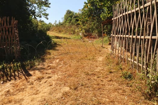 Border crossing between Thailand and Myanmar, protected with barbed wire, close to the traditional chinese village of Ban Rak Thai, Mae Aw, Thailand 2023
