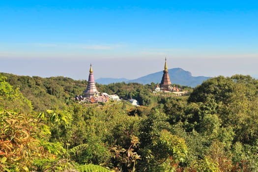 View from the Kew Mae Pan Nature Trail onto the Queen's Pagoda and the King's Pagoda, surrounded by a dense forest, jungle, Doi Inthanon National Park, close to Chiang Mai, Thailand 2023