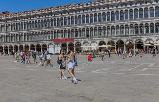 Venice, Italy - July 26, 2024: Asian tourist standing on San Marco square. Venice is very popular tourist destination. Venice, Italy