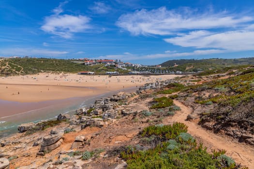 Sintra, Portugal: April 13, 2024: People at the beach of Foz do Lizandro, Ericeira, Portugal