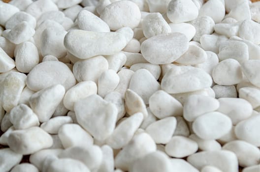 Close up of small white rocks with customizable space for text or messages.