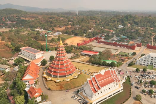View from the highest, top floor inside the head of the Guan Yin Statue onto the Phop Chok Dhamma Chedi, the Wat Huay Pla Kang Temple and the surrounding landscape Chiang Rai, Thailand 2023
