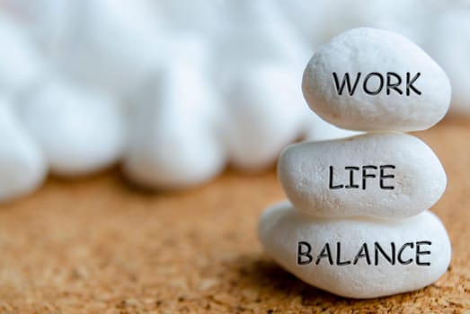 Work life balance text engraved on white stones. Life balance concept.