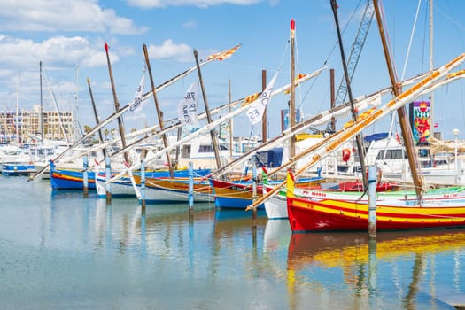 Le Barcarès, France - May 22, 2024: Fishing boats photographed in marina of Port Barcarès, bright light and vivid colors