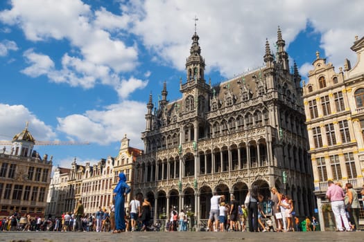 Brussels, Belgium - August 20 2022 : Tourists discovering the famous Grand Place and the historical buildings in Brussels. Photography taken in Belgium