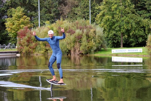 Kitsurfer Ben Beholz gives taster courses on the Messesee and does show acts in pump and wingfoiling  The 63rd Interboot 2024 trade fair in Friedrichshafen has opened