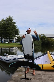 Kitsurfer Ben Beholz gives taster courses on the Messesee and does show acts in pump and wingfoiling  The 63rd Interboot 2024 trade fair in Friedrichshafen has opened