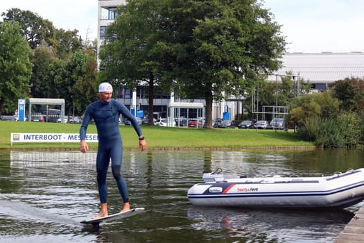 Kitsurfer Ben Beholz gives taster courses on the Messesee and does show acts in pump and wingfoiling  The 63rd Interboot 2024 trade fair in Friedrichshafen has opened