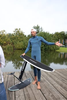 Kitsurfer Ben Beholz gives taster courses on the Messesee and does show acts in pump and wingfoiling  The 63rd Interboot 2024 trade fair in Friedrichshafen has opened