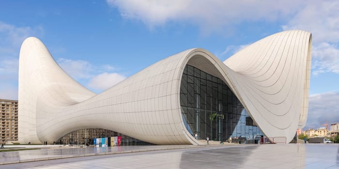 Baku, Azerbaijan - May 7, 2024: The iconic Heydar Aliyev Centre, exemplifies modern architecture with its fluid, wave-like design. The building was designed by the late architect Zaha Hadid