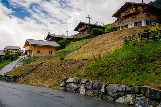 View on wooden traditional alpine chalets in swiss mountain village Leysin. Lake Geneva Region Vaud Switzerland