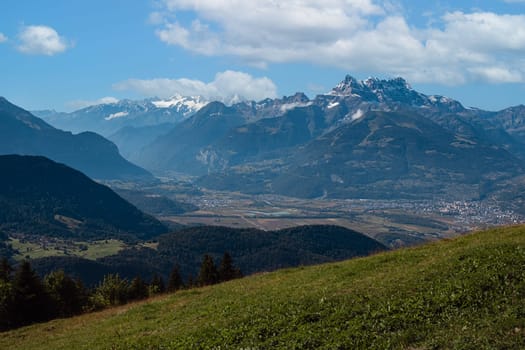 Rhone valley panorama and Dents du Midi on a cloudy day in summer seen from Leysin , Vaud, Switzerland