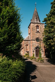 Saint-André church near the Coo Waterfalls on a summer day. Stavelot, Province Liege, Wallonia, Belgium