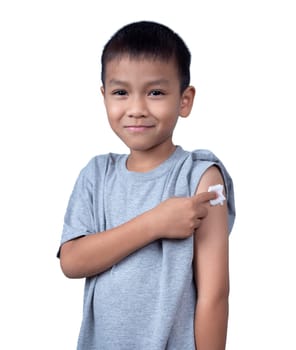 Little asian child boy wearing short-sleeve shirt with bandage plaster on her arm after vaccination for boost immunity. Injection covid vaccine, Tetanus vaccine, Flu vaccine, healthcare for children.