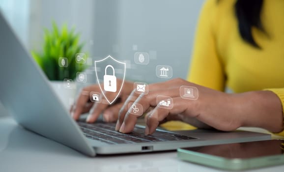 Cybersecurity and Global network security technology concept, Businesswoman protecting personal data on computer with virtual interface, Internet secure technology, Cyber security.