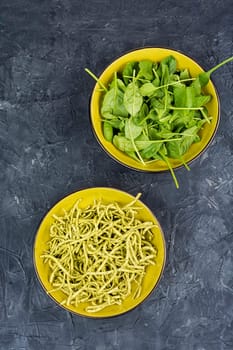 Italian cuisine vegan food Conchiglie pasta topped with spinach. Copy space.