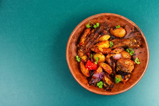 Spare ribs or grilled ribs with stewed vegetables. Barbecue ribs.