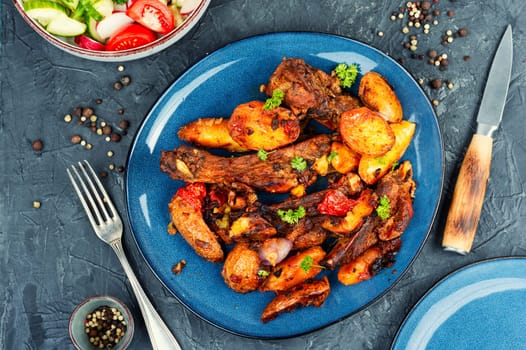 Spare ribs or grilled ribs with stewed vegetables. Barbecue ribs.