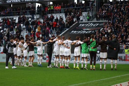 The players of newly promoted FC St. Pauli are celebrated by their own fans after the 0:3 victory in Freiburg after the match of the 1st FBL: 24-25: 1. FBL: 24-25: 5. Sptg. SC Freiburg - FC St. Pauli  DFL REGULATIONS PROHIBIT ANY USE OF PHOTOGRAPHS AS IMAGE SEQUENCES AND/OR QUASI-VIDEONann  Photo: Joachim Hahne/johapress