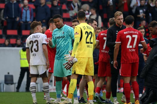 In the end and after the 0:3,goalkeeper Noah Atubolu (SC Freiburg) could only congratulate his strong colleague goalkeeper Nikola Vasilj (FC St. Pauli) on the victory after the game of the 1st FBL: 24-25: 1st FBL: 24-25: 5th Sptg. SC Freiburg - FC St. Pauli  DFL REGULATIONS PROHIBIT ANY USE OF PHOTOGRAPHS AS IMAGE SEQUENCES AND/OR QUASI-VIDEONann  Photo: Joachim Hahne/johapress