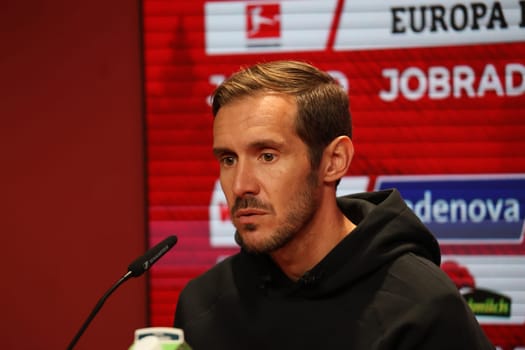 Head coach Julian Schuster (SC Freiburg) at the press conference,PK after the match of the 1st FBL: 24-25: 1st FBL: 24-25: 5th Sptg. SC Freiburg - FC St. Pauli  DFL REGULATIONS PROHIBIT ANY USE OF PHOTOGRAPHS AS IMAGE SEQUENCES AND/OR QUASI-VIDEONann  Photo: Joachim Hahne/johapress