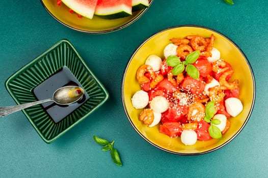 Summer salad with watermelon, mozzarella cheese and shrimp.