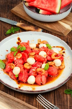Summer salad with watermelon, mozzarella cheese and shrimp.